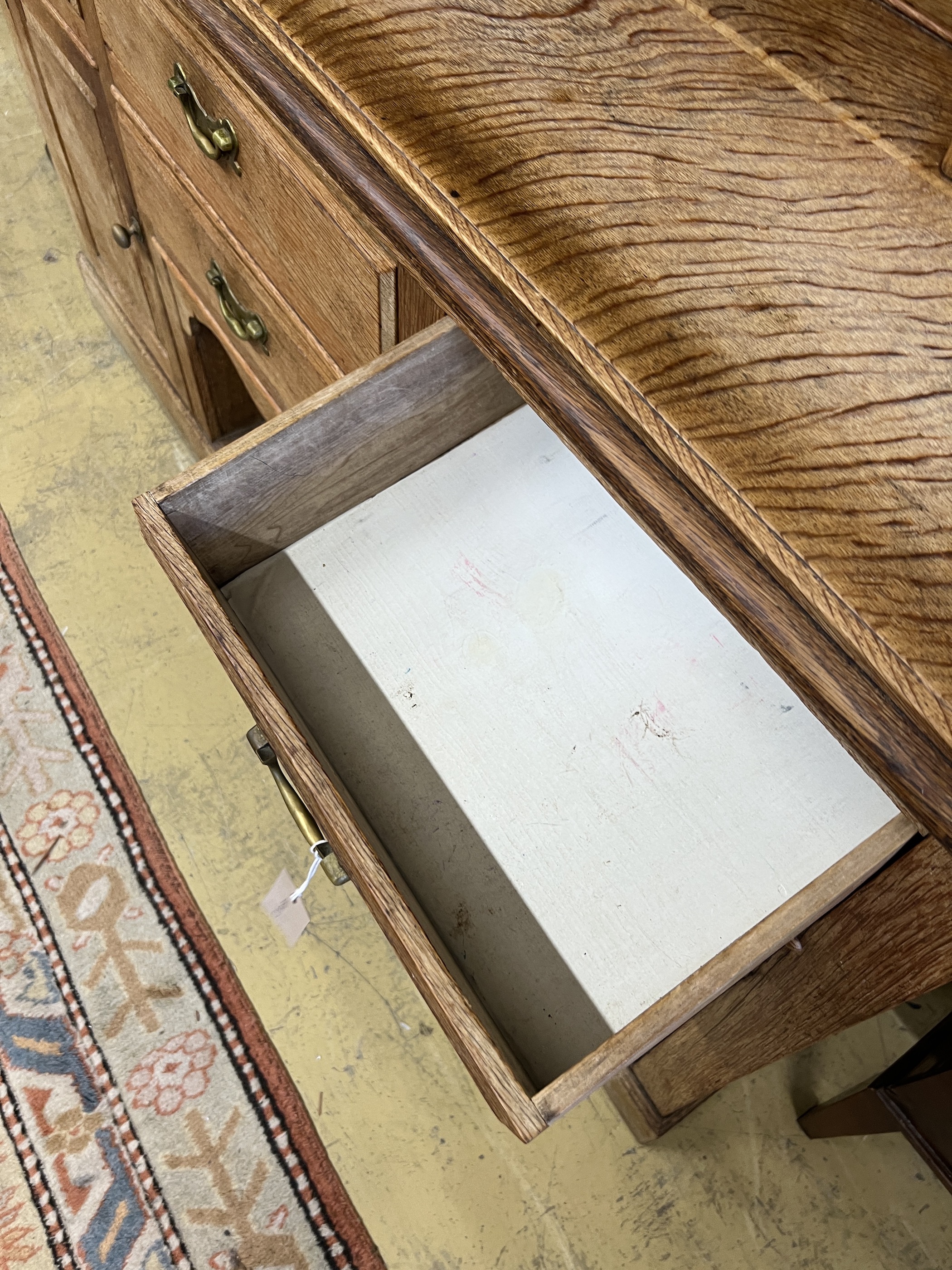 An early 20th century bleached oak dresser, width 165cm, depth 48cm, height 223cm
